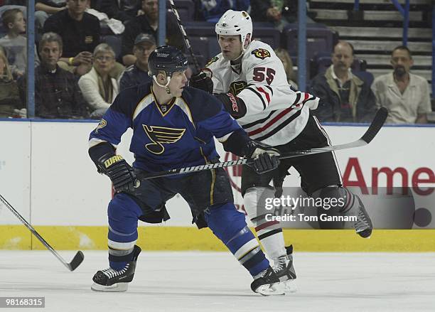 Keith Tkachuk of the St. Louis Blues skates against Ben Eager of the Chicago Blackhawks on March 30, 2010 at Scottrade Center in St. Louis, Missouri.