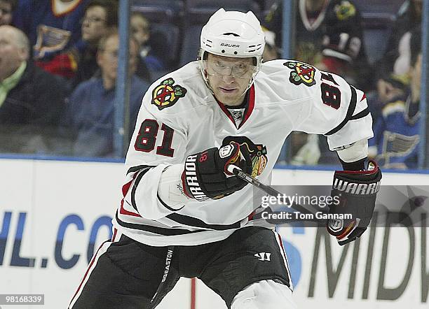 Marian Hossa of the Chicago Blackhawks skates against Eric Brewer of the St. Louis Blues on March 30, 2010 at Scottrade Center in St. Louis, Missouri.