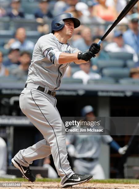 Kyle Seager of the Seattle Mariners follows through on a second inning two run home run against the New York Yankees at Yankee Stadium on June 21,...