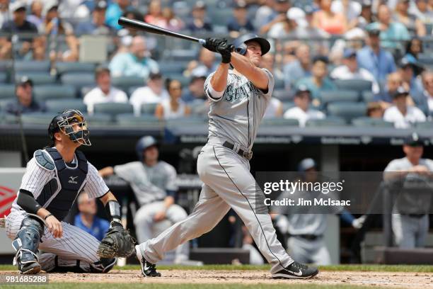 Kyle Seager of the Seattle Mariners follows through on a second inning two run home run against the New York Yankees at Yankee Stadium on June 21,...