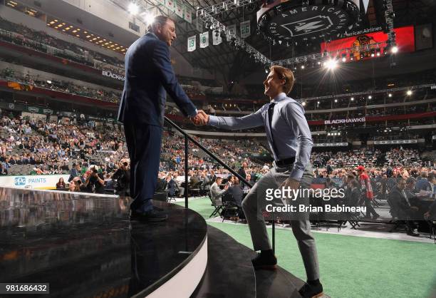 Nicolas Beaudin greets NHL commissioner Gary Bettman after being selected twenty-seventh overall by the Chicago Blackhawks during the first round of...