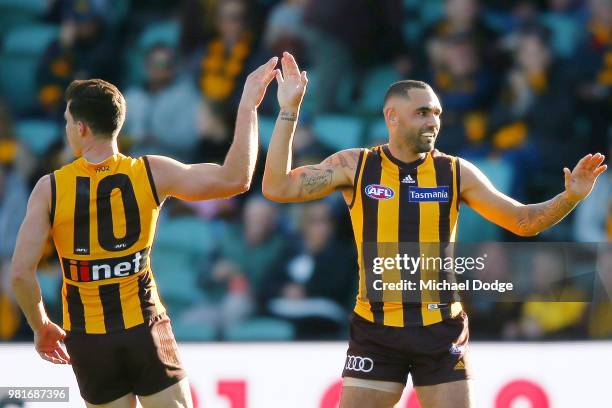 Shaun Burgoyne of the Hawks celebrates a goal during the round 14 AFL match between the Hawthorn Hawks and the Gold Coast Suns at University of...