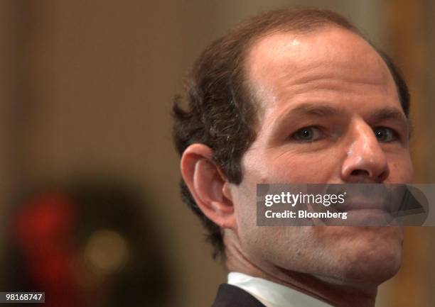 New York Attorney General Eliot Spitzer listens to a presentation during a press conference at the New York Stock Exchange on December 20, 2002. It...