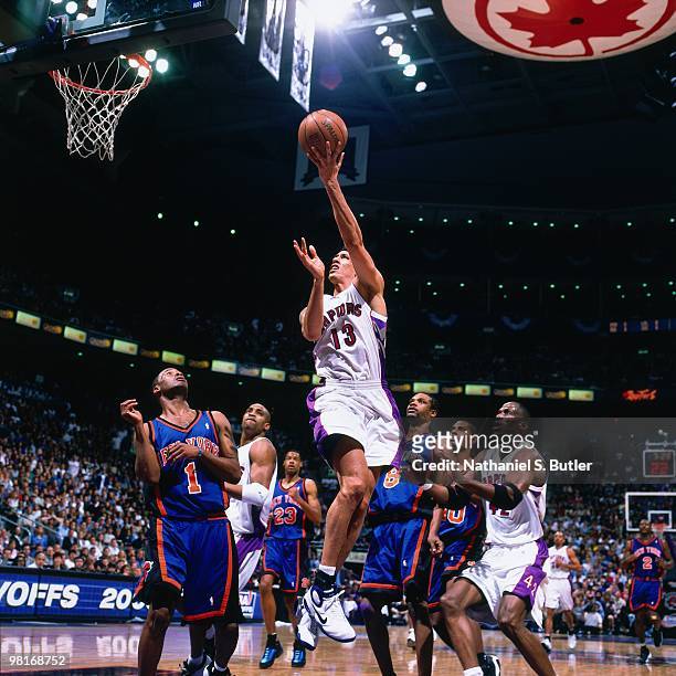 Doug Christie of the Toronto Raptors shoots a layup against Chris Childs of the New York Knicks during Game Three of the 2000 Eastern Conference...