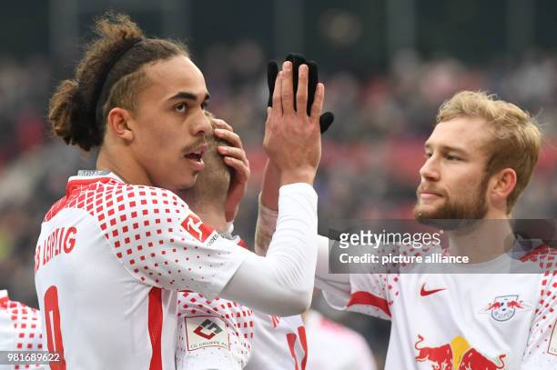 March 2018, Germany, Hannover: soccer, Bundesliga, Hannover 96 vs RB Leipzig in the HDI Arena. Leipzig's Yussuf Poulsen is celebrating his goal with...
