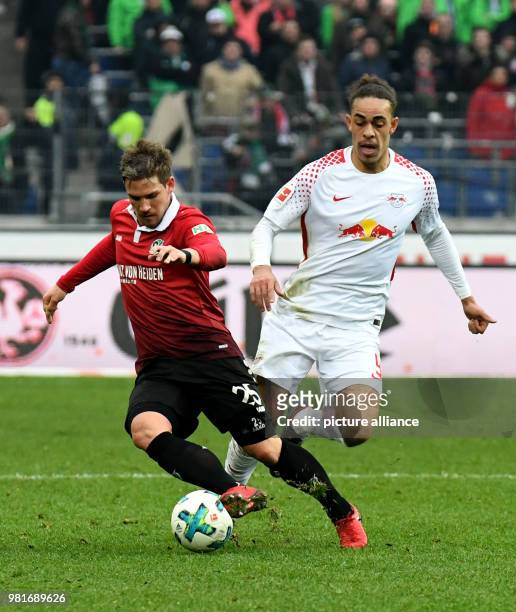 March 2018, Germany, Hannover: soccer, Bundesliga, Gameday No.28, Hannover 96 vs RB Leipzig in the HDI Arena. Hannover's Oliver Sorg and Leipzig's...