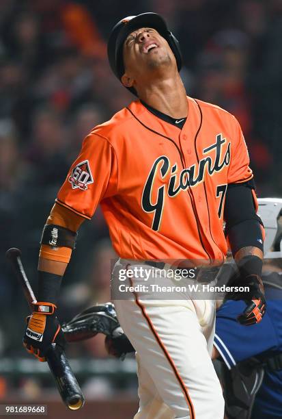 Gorkys Hernandez of the San Francisco Giants reacts after a pitch was called a strike while he was batting against the San Diego Padres in the bottom...