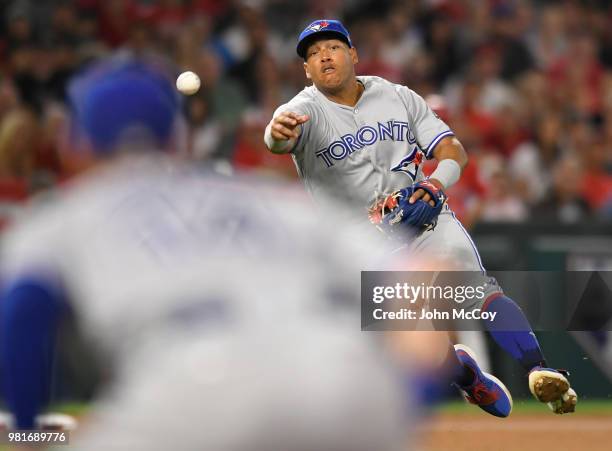 Yangervis Solarte of the Toronto Blue Jays throws out Michael Hermosillo of the Los Angeles Angels of Anaheim in the eighth inning at Angel Stadium...