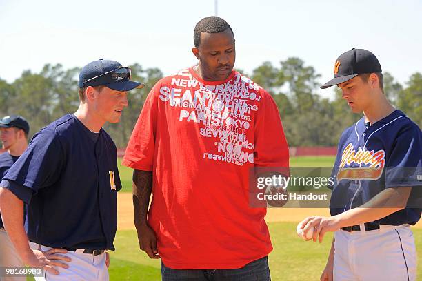 In this handout photo provided by Disney, New York Yankees pitcher CC Sabathia gives some pitching advice to Steven Giaononi pitcher for Whitney M....