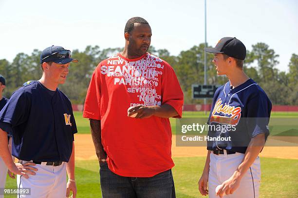 In this handout photo provided by Disney, New York Yankees pitcher CC Sabathia talks with Steven Giaononi pitcher for Whitney M. Young Magnet High...