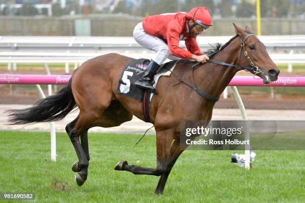 Remember the Name ridden by Damien Oliver wins the Macedon and Goldfields Handicap at Flemington Racecourse on June 23, 2018 in Flemington, Australia.