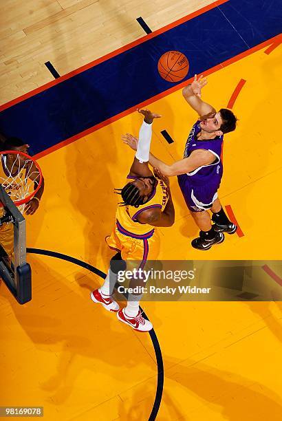 Omri Casspi of the Sacramento Kings shoots over Ronny Turiaf of the Golden State Warriors during the game on February 17, 2009 at Oracle Arena in...