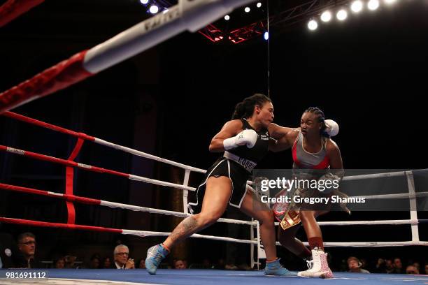 Claressa Shields battles Hanna Gabriels of Costa Rica in the first round during their IBF and WBA world middleweight championship fight at the...