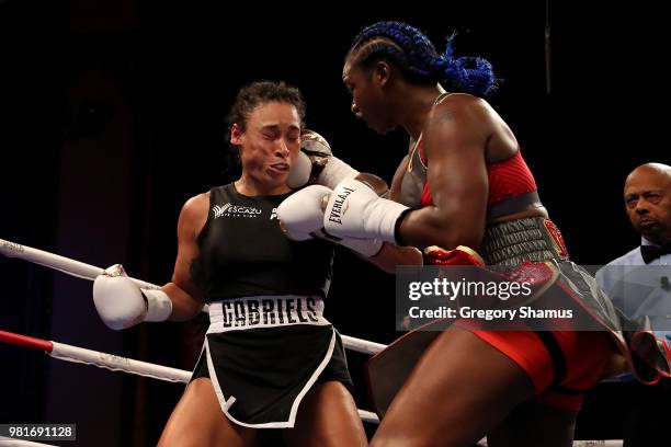 Claressa Shields battles Hanna Gabriels of Costa Rica in the first round during their IBF and WBA world middleweight championship fight at the...