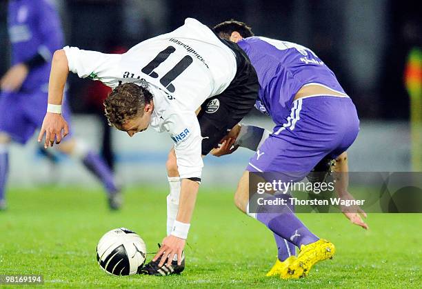 Julian Schauerte of Sandhausen battles for the ball with Ricky Pinheiro of Osnabrueck during the 3. Liga match between SV Sandhausen and VfL...