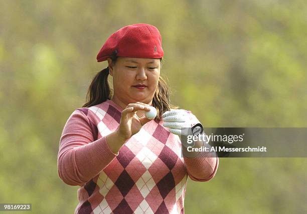 Christina Kim checks her ball on the fourth tee during the final round at the LPGA Tournament of Champions, November 14, 2004 in Mobile, Alabama.