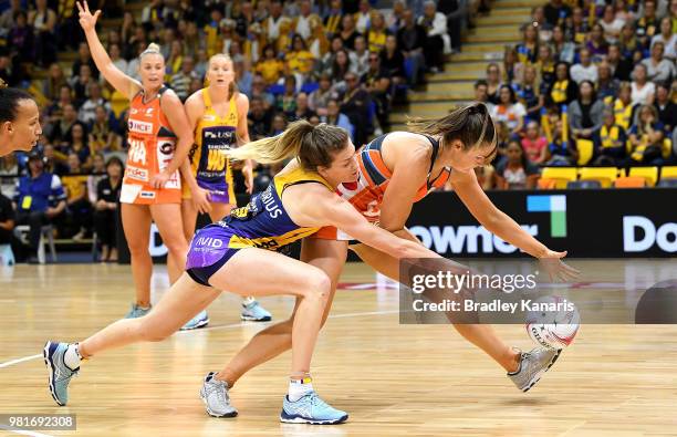 Karla Pretorius of the Lightning and Caitlin Bassett of the Lightning challenge for the ball during the round eight Super Netball match between the...