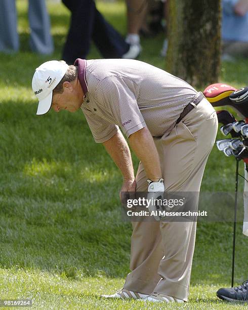 Fred Funk checks a ball in the rough in first-round play in The Memorial Tournament, June 3, 2004 in Dublin, Ohio.