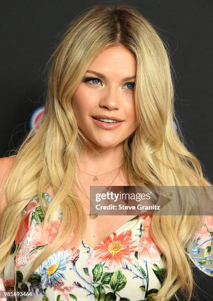 Witney Carson arrives at the 2018 Radio Disney Music Awards at Loews Hollywood Hotel on June 22, 2018 in Hollywood, California.