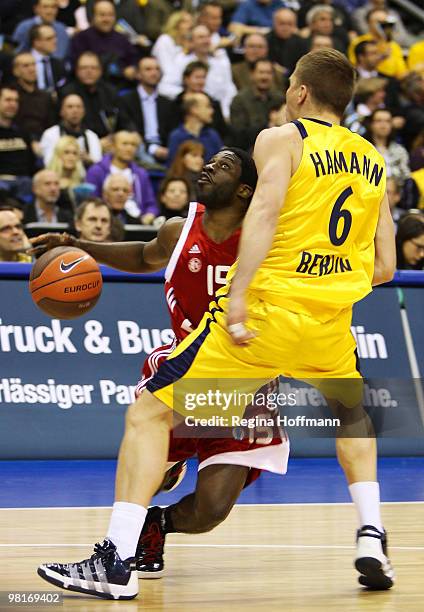 Pooh Jeter, #15 of Hapoel Jerusalem competes with Steffen Hamann, #6 of Alba Berlin during the Eurocup Quarterfinals Game 2 between Alba Berlin vs...