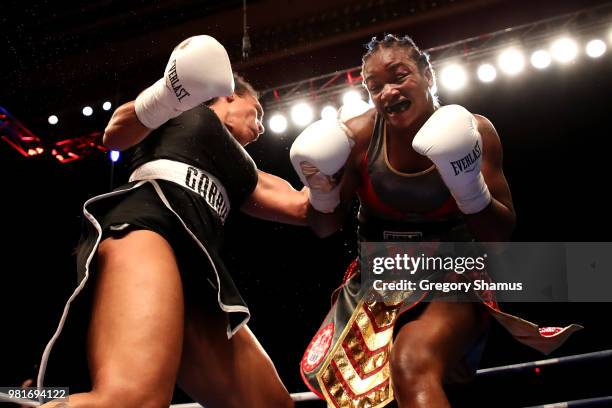 Claressa Shields battles Hanna Gabriels of Costa Rica in the seventh round during their IBF and WBA world middleweight championship fight at the...