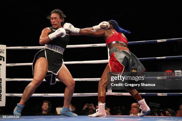Claressa Shields battles Hanna Gabriels of Costa Rica in the ninth round during their IBF and WBA world middleweight championship fight at the...