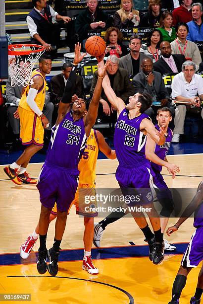 Jason Thompson and Omri Casspi of the Sacramento Kings go after a rebound during the game against the Golden State Warriors on February 17, 2009 at...