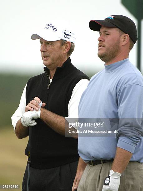 Larry Nelson and his son, Drew, wait to tee off on the 18th hole during first-round play in the Office Depot Father/Son Challenge at ChampionsGate...