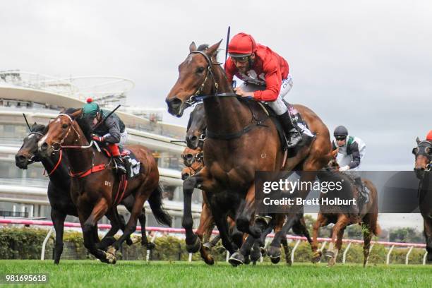 Remember the Name ridden by Damien Oliver wins the Macedon and Goldfields Handicap at Flemington Racecourse on June 18, 2018 in Flemington, Australia.