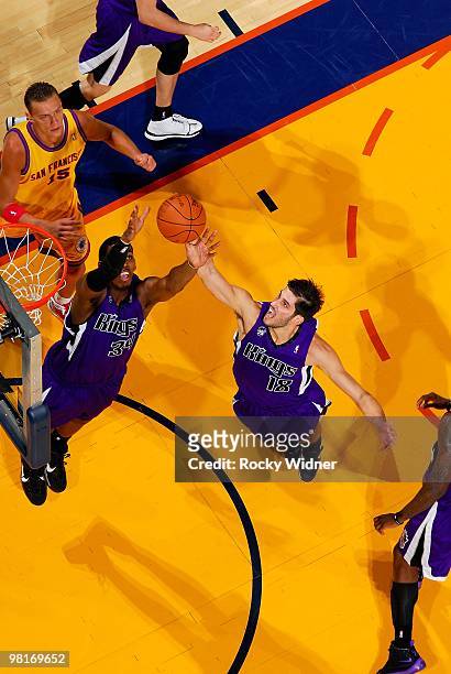 Jason Thompson and Omri Casspi of the Sacramento Kings go after a rebound during the game against the Golden State Warriors on February 17, 2009 at...