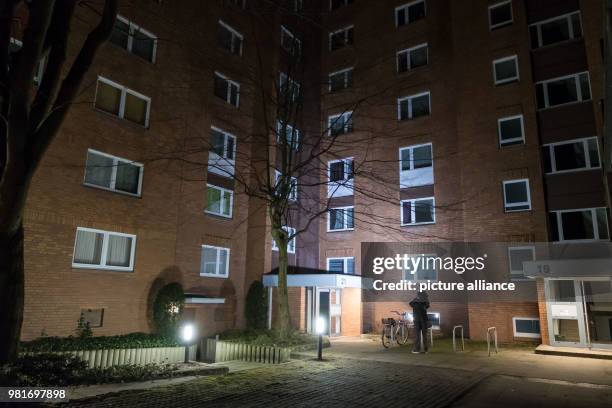 March 2018, Germany, Hannover: A cameraman in front of an apartment house in the district Gross-Buchholz, where two dead people were found. Those...