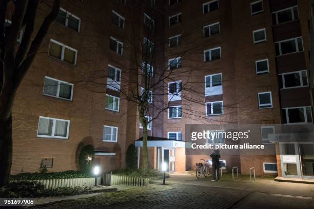 April 2018, Germany, Hannover: A cameraman in front of an apartment house in the district Gross-Buchholz, where two dead people were found. Those...