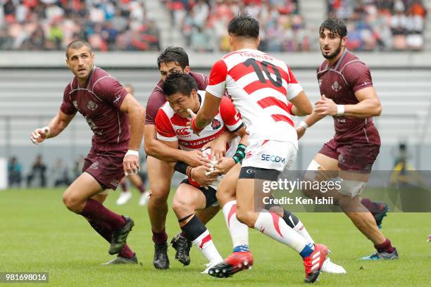 Harumichi Tatekawa of Japan is tackled during the rugby international match between Japan and Georgia at Toyota Stadium on June 23, 2018 in Toyota,...