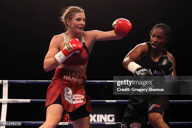 Christina Hammer of Germany battles Tori Nelson in the second round during their WBC and WBO world middleweight championship fight at the Masonic...