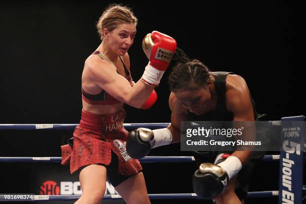 Christina Hammer of Germany battles Tori Nelson in the third round during their WBC and WBO world middleweight championship fight at the Masonic...