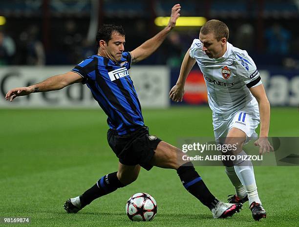 Inter Milan's Serbian midfielder Dejan Stankovic fights for the ball with Cska Moscow's midfielder Pavel Mamaev during their Champions League first...