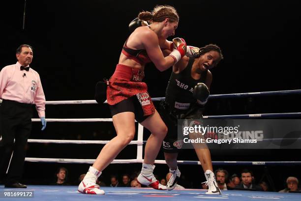 Christina Hammer of Germany battles Tori Nelson in the fifth round during their WBC and WBO world middleweight championship fight at the Masonic...