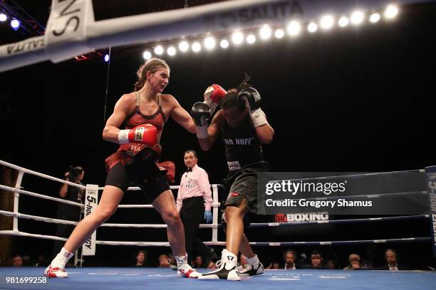 Christina Hammer of Germany battles Tori Nelson in the seventh round during their WBC and WBO world middleweight championship fight at the Masonic...