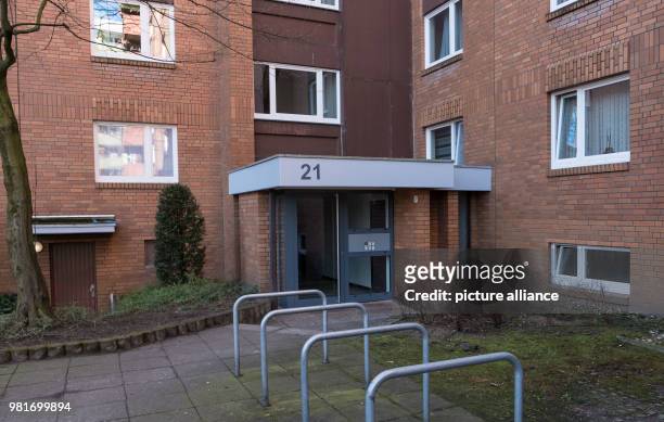 March 2018, Germany, Hannover: The entrance to an apartment house in the district Gross-Buchholz, where two dead people were found. A dog has, after...