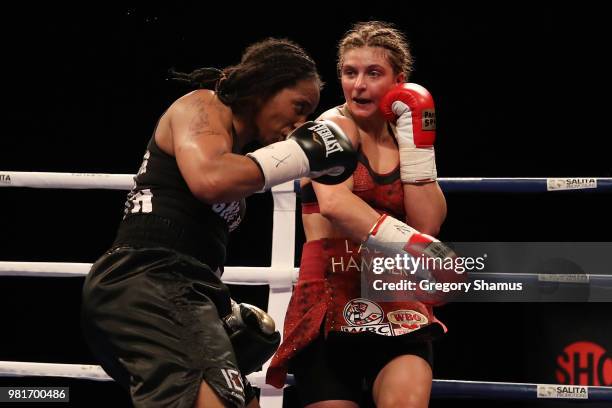 Christina Hammer of Germany battles Tori Nelson in the seventh round during their WBC and WBO world middleweight championship fight at the Masonic...