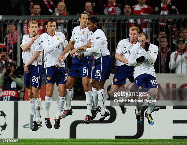 Free kick from Frank Ribery of Bayern Muenchen deflects off Wayne Rooney of Manchester United for Bayern's 1st goal during the UEFA Champions League...