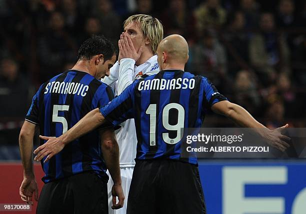 Cska Moscow's Serbian midfielder Milos Krasic reacts after a missed goal in front of Inter Milan's Serbian midfielder Dejan Stankovic and Inter...