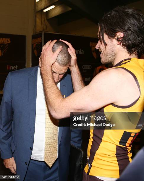 Isaac Smith of the Hawks celebrates the win with Hawks President Jeff Kennett during the round 14 AFL match between the Hawthorn Hawks and the Gold...