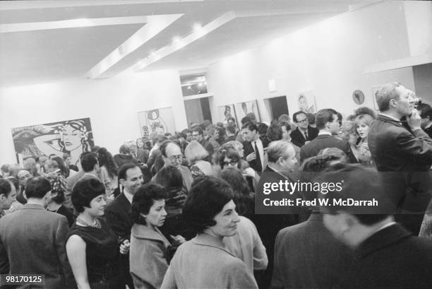 Overview of art patrons as they attend the 'First International Girlie Exhibit' at the Pace Gallery, New York, New York, January 7, 1964. The...