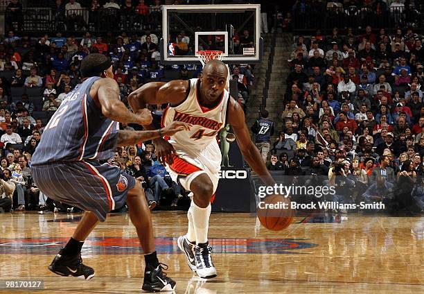 Anthony Tolliver of the Golden State Warriors drives to the basket against Tyrus Thomas of the Charlotte Bobcats during the game at Time Warner Cable...