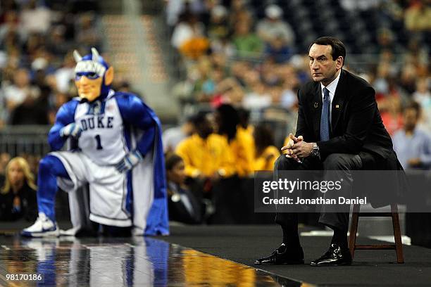 Head coach Mike Krzyzewski of the Duke Blue Devils and the Blue Davils mascot watch as the Blue Devils take on the Purdue Boilermakers during the...