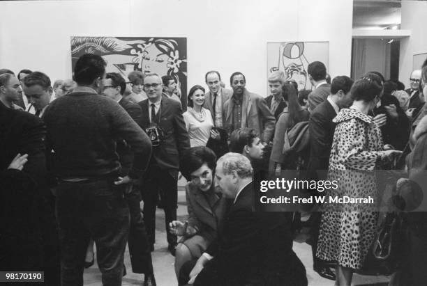 Art patrons attend the 'First International Girlie Exhibit' at the Pace Gallery, New York, New York, January 7, 1964. The exhibition explored the...