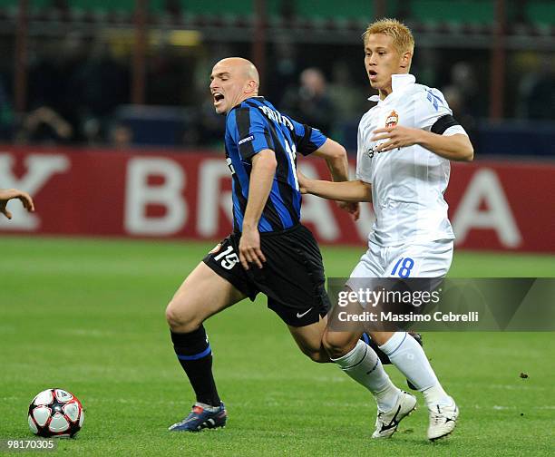 Esteban Cambiasso of FC Internazionale Milano battles for the ball against Keisuke Honda of CSKA Moscow during the UEFA Champions League Quarter...