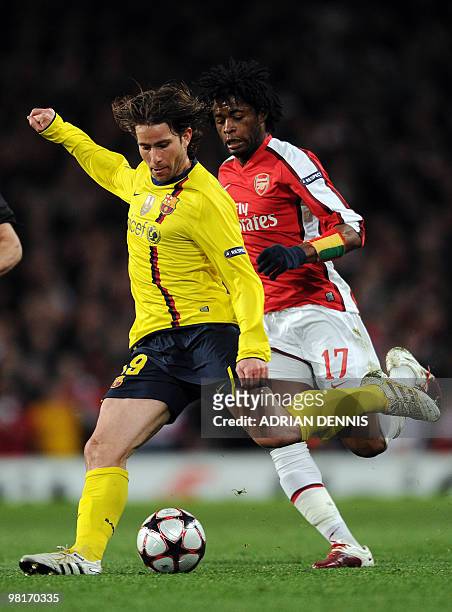 Barcelona's Brazilian defender Maxwell vies with Arsenal's Cameroonian defender Alexandre Song during their UEFA Champions League quarter-final 1st...