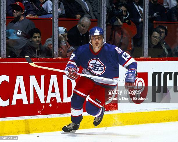 Teemu Selanne of the Winnipeg Jets skates against the Montreal Canadiens in the early 1990's at the Montreal Forum in Montreal, Quebec, Canada.